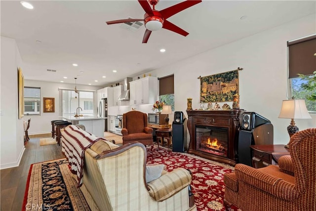 19533 Cardigan Dr, Northridge, CA 91324 - living area featuring a glass covered fireplace, recessed lighting, light wood-style flooring, visible vents, and ceiling fan
