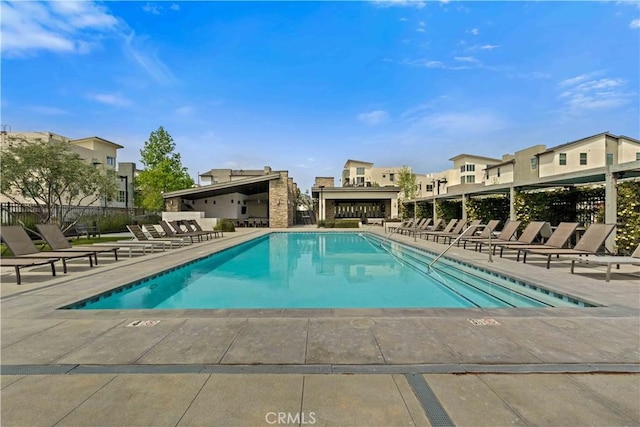 19533 Cardigan Dr, Northridge, CA 91324 - community pool featuring a patio area, a residential view, and fence