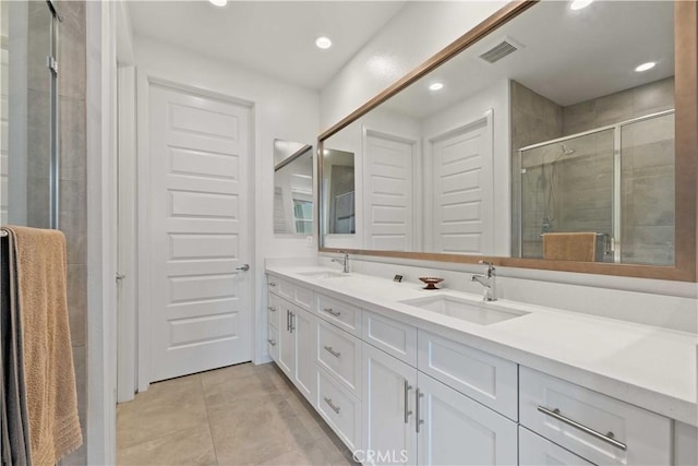 19533 Cardigan Dr, Northridge, CA 91324 - bathroom featuring a shower stall, double vanity, a sink, and visible vents