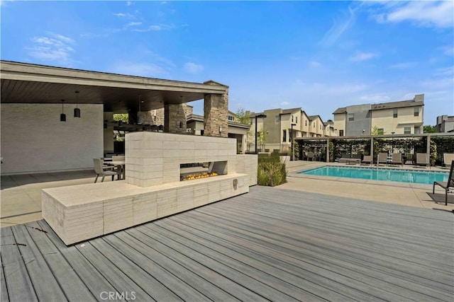 19533 Cardigan Dr, Northridge, CA 91324 - wooden terrace with a residential view, a community pool, a multi sided fireplace, and a patio
