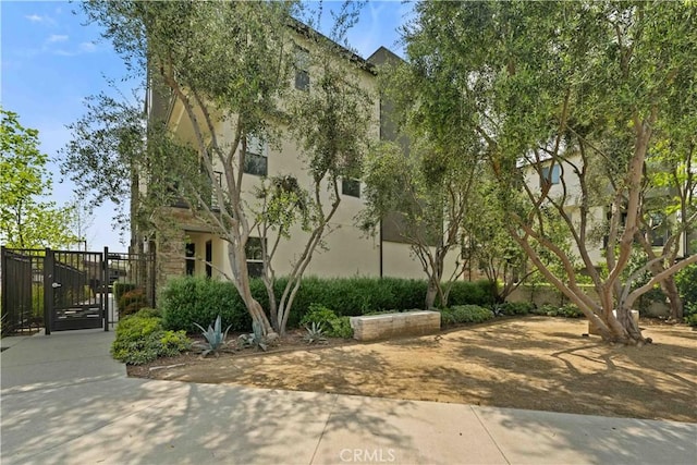 19533 Cardigan Dr, Northridge, CA 91324 - view of side of home with stucco siding and a gate