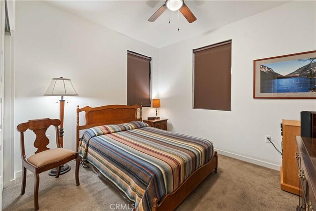 19533 Cardigan Dr, Northridge, CA 91324 - bedroom with light carpet, ceiling fan, and baseboards