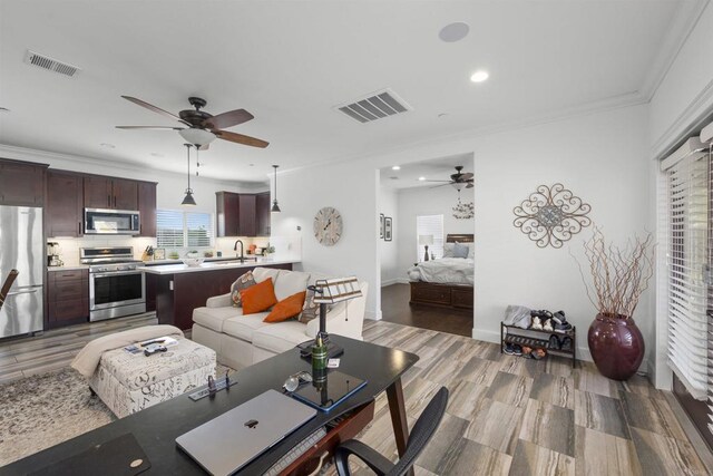 3024 Natureview Ct, Chula Vista, CA 91914 - living area with a ceiling fan, recessed lighting, light wood finished floors, ornamental molding, and baseboards