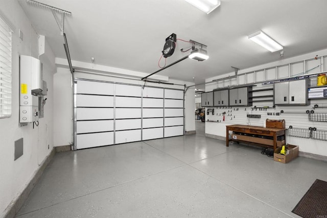 3024 Natureview Ct, Chula Vista, CA 91914 - garage featuring a garage door opener and a workshop area