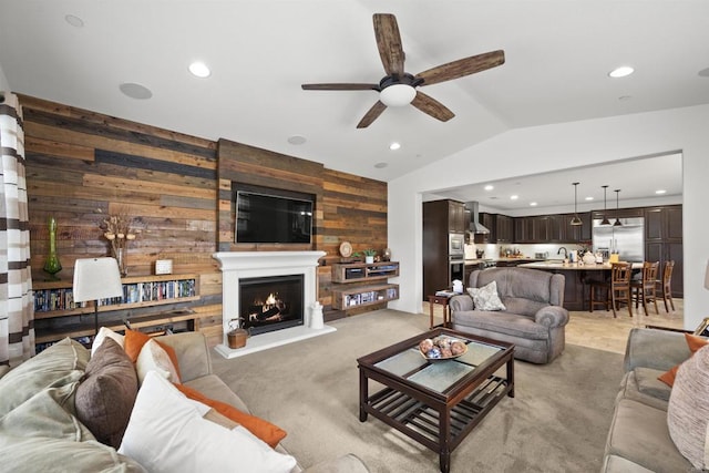 3024 Natureview Ct, Chula Vista, CA 91914 - living area with wooden walls, ceiling fan, vaulted ceiling, recessed lighting, and a lit fireplace