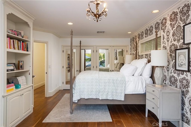 bedroom with crown molding, dark wood-type flooring, wallpapered walls, visible vents, and french doors