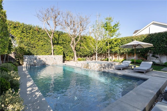 view of swimming pool featuring fence and a fenced in pool