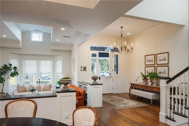 2400 Holly Ln, Newport Beach, CA 92663 - entrance foyer with dark wood-style flooring, a chandelier, stairway, and ornamental molding