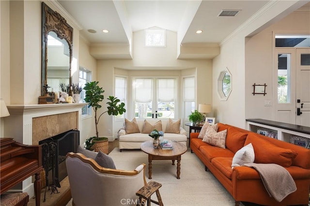 living room featuring a fireplace, visible vents, crown molding, and lofted ceiling