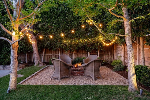 2400 Holly Ln, Newport Beach, CA 92663 - fenced backyard featuring an outdoor fire pit and a patio