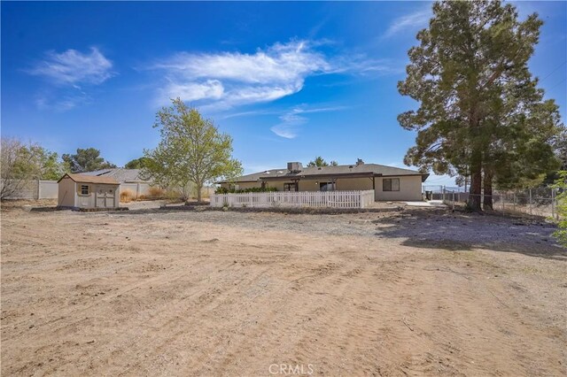 15084 Tacony Rd, Apple Valley, CA 92307 - exterior space with an outbuilding, a storage unit, and fence