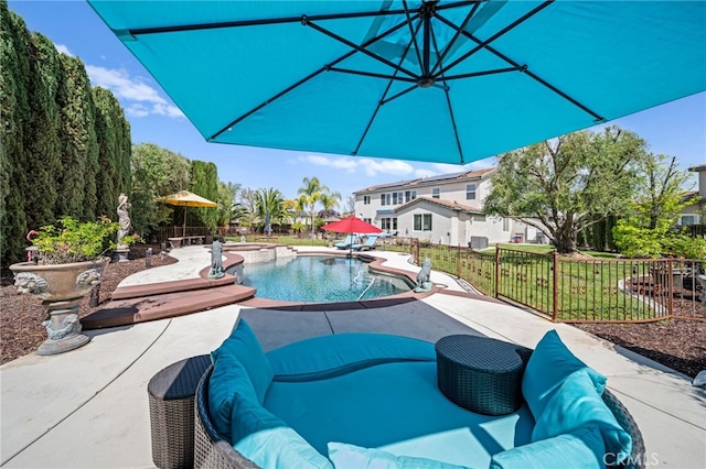 view of swimming pool featuring a patio area, a fenced in pool, and fence