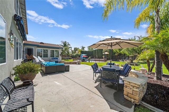 view of patio / terrace featuring outdoor lounge area and fence
