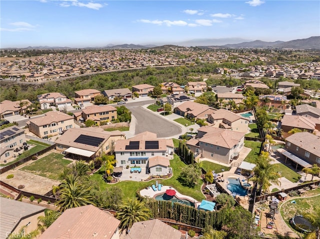 drone / aerial view featuring a residential view and a mountain view