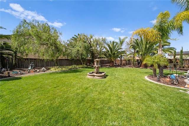view of yard featuring a fenced backyard