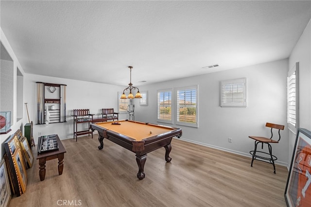 recreation room with visible vents, light wood-type flooring, plenty of natural light, and pool table