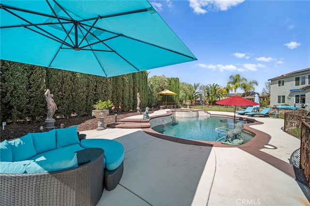 view of swimming pool with a pool with connected hot tub and a patio