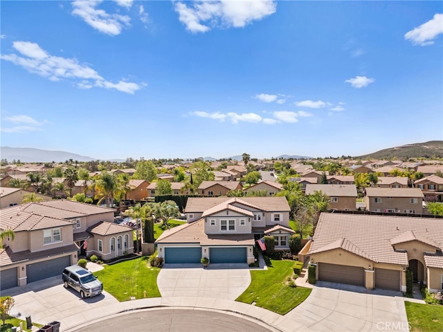 drone / aerial view with a residential view and a mountain view