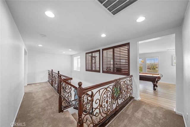 corridor featuring baseboards, recessed lighting, carpet flooring, an upstairs landing, and visible vents