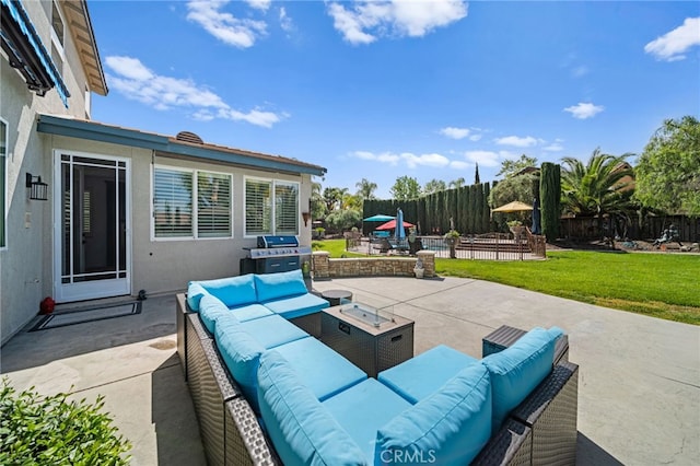 view of patio / terrace with an outdoor living space, grilling area, and fence