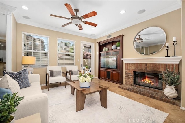 115 Vermillion, Irvine, CA 92603 - living room featuring ornamental molding, recessed lighting, a fireplace, visible vents, and ceiling fan