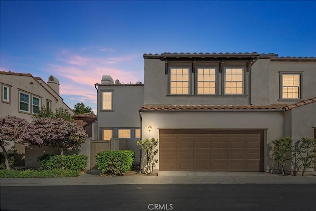 115 Vermillion, Irvine, CA 92603 - mediterranean / spanish home with a tiled roof, a garage, stucco siding, and fence