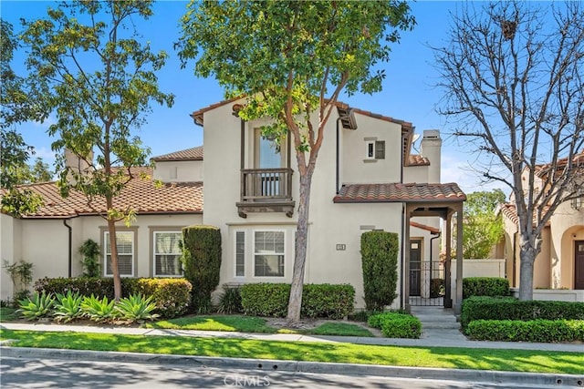 115 Vermillion, Irvine, CA 92603 - view of front facade with a tile roof, a chimney, and stucco siding