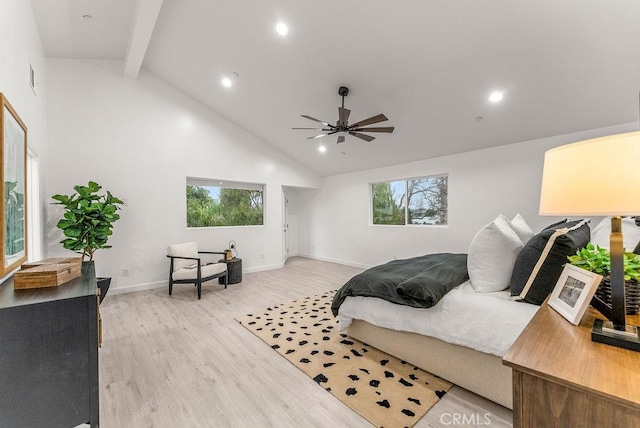 bedroom featuring light wood-style floors, high vaulted ceiling, multiple windows, and beam ceiling