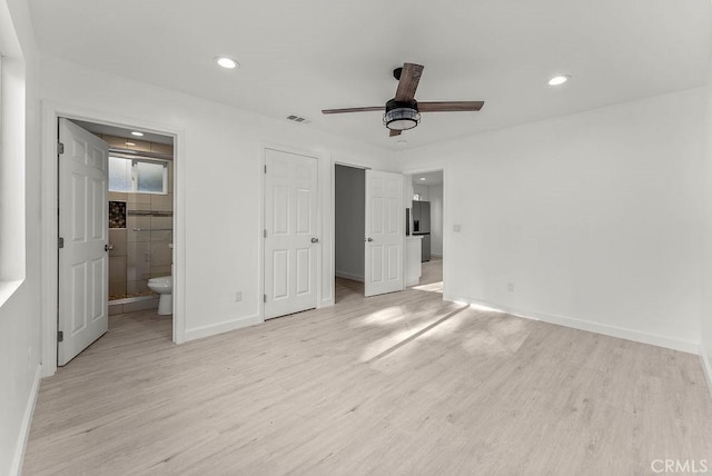 unfurnished bedroom featuring light wood finished floors, baseboards, stainless steel refrigerator with ice dispenser, and recessed lighting