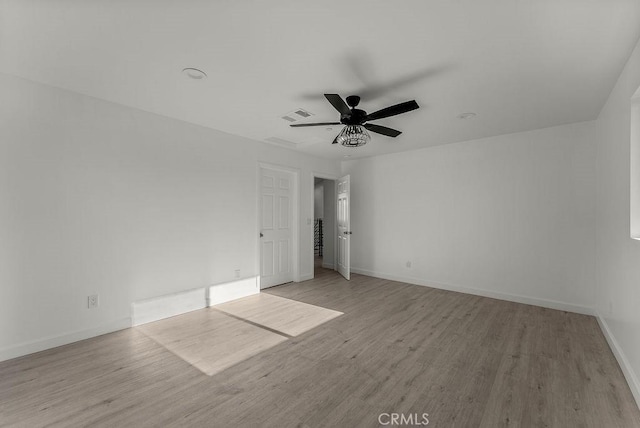 unfurnished bedroom with visible vents, baseboards, ceiling fan, and light wood-style floors