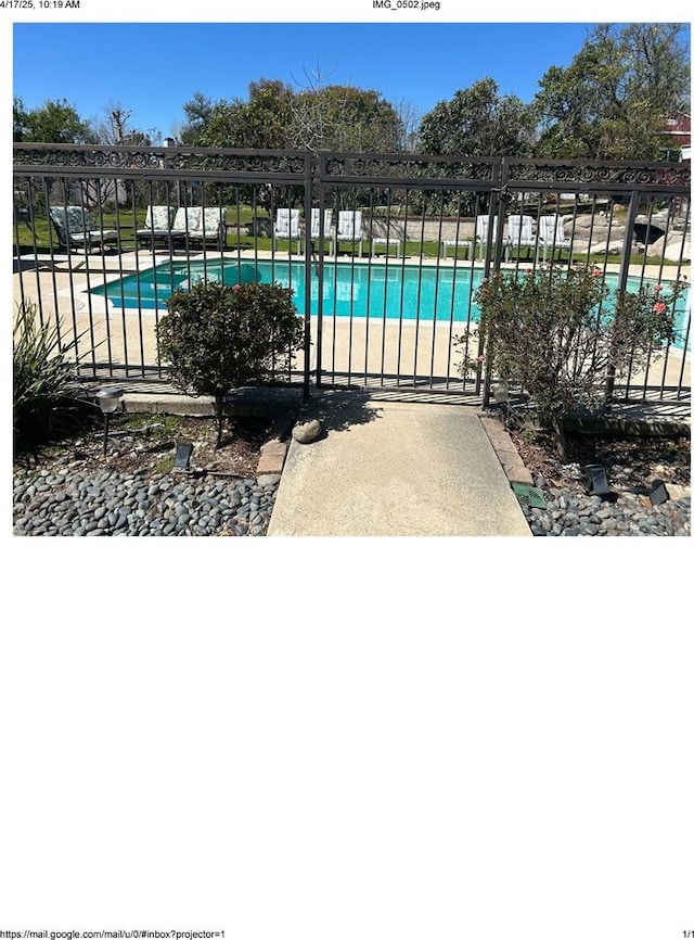 view of pool with fence and a fenced in pool