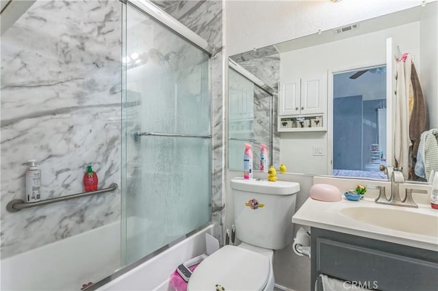18641 Nathan Hill Dr Unit 8, Canyon Country, CA 91351 - bathroom with toilet, vanity, visible vents, and bath / shower combo with glass door