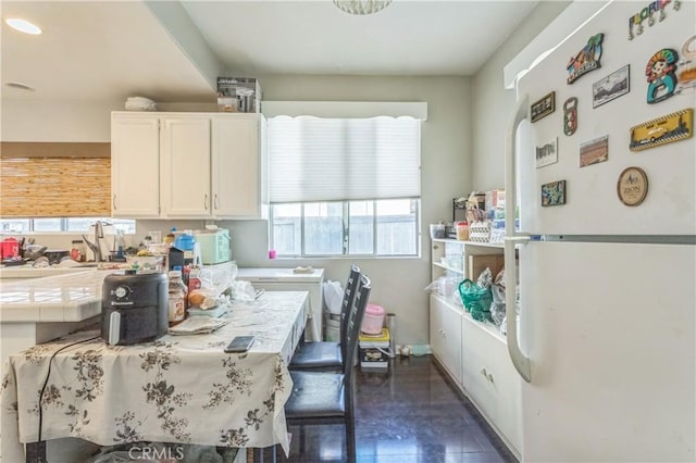 18641 Nathan Hill Dr Unit 8, Canyon Country, CA 91351 - kitchen with white cabinetry, white appliances, and tile countertops