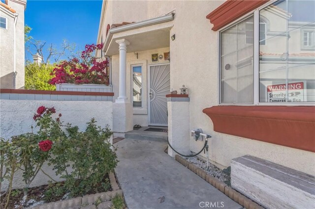 18641 Nathan Hill Dr Unit 8, Canyon Country, CA 91351 - doorway to property with stucco siding