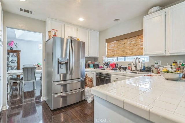 18641 Nathan Hill Dr Unit 8, Canyon Country, CA 91351 - kitchen with visible vents, white cabinets, stainless steel refrigerator with ice dispenser, a sink, and tile countertops