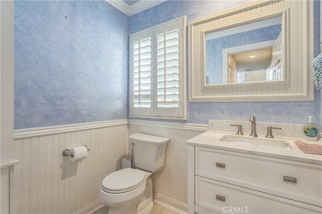 18641 Nathan Hill Dr Unit 8, Canyon Country, CA 91351 - half bathroom featuring toilet, vanity, and wainscoting