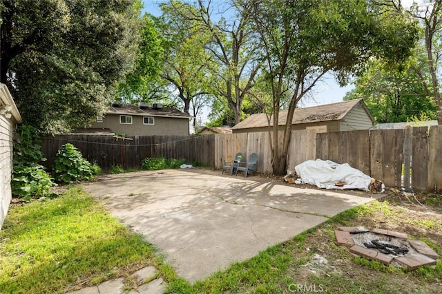 1109 Ivy St, Chico, CA 95928 - exterior space featuring a patio area, a fenced backyard, and an outdoor fire pit