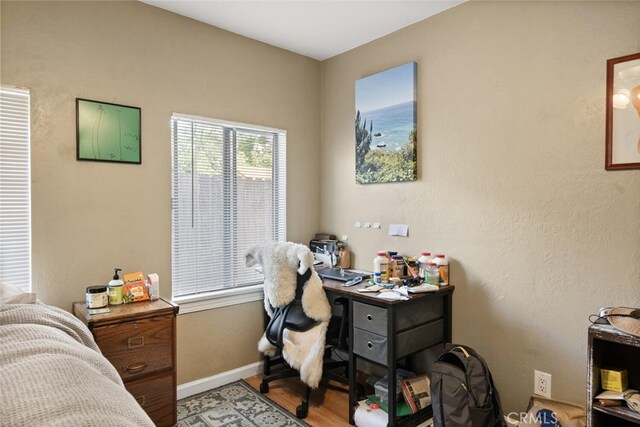 1109 Ivy St, Chico, CA 95928 - home office with baseboards and wood finished floors
