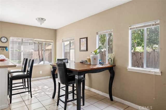 1109 Ivy St, Chico, CA 95928 - dining area with light tile patterned floors and baseboards