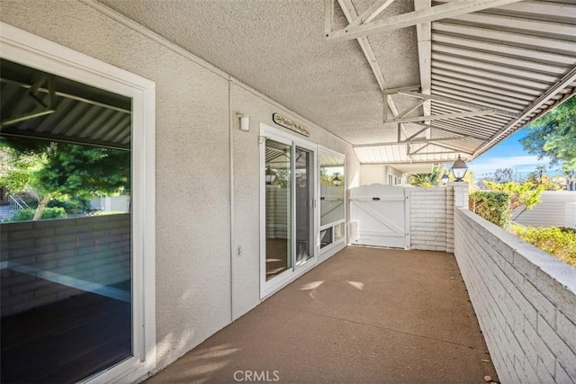 659 Avenida Sevilla Unit D, Laguna Woods, CA 92637 - view of patio with a gate