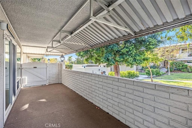 659 Avenida Sevilla Unit D, Laguna Woods, CA 92637 - view of patio / terrace featuring a ceiling fan and a gate