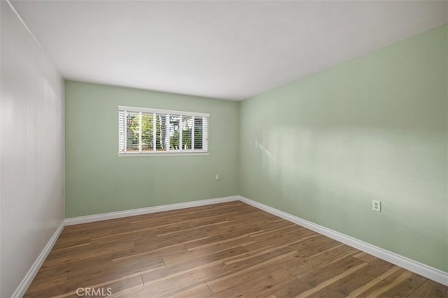 659 Avenida Sevilla Unit D, Laguna Woods, CA 92637 - spare room with baseboards and wood finished floors