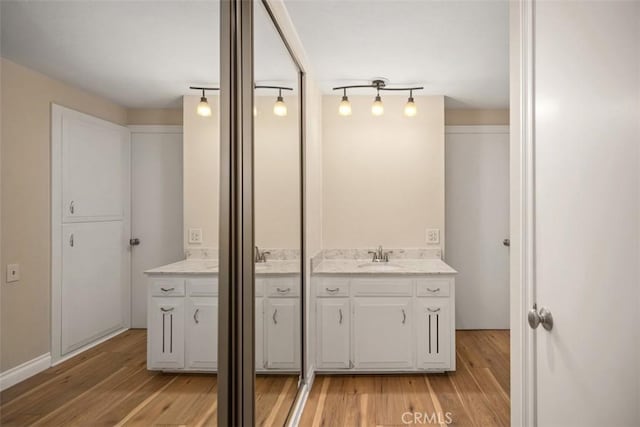 659 Avenida Sevilla Unit D, Laguna Woods, CA 92637 - bathroom featuring wood finished floors and vanity