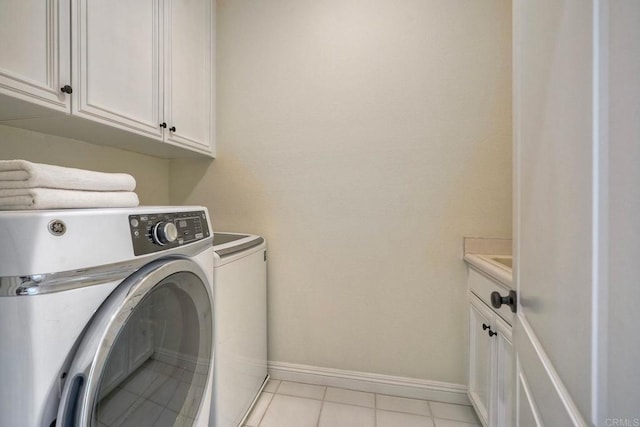 1664 Aryana Dr, Encinitas, CA 92024 - laundry room with cabinet space, washing machine and clothes dryer, and light tile patterned flooring