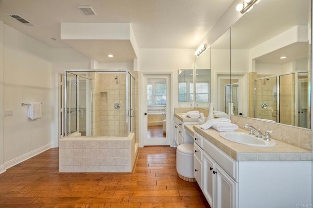 1664 Aryana Dr, Encinitas, CA 92024 - bathroom featuring hardwood / wood-style flooring, vanity, a shower stall, and recessed lighting