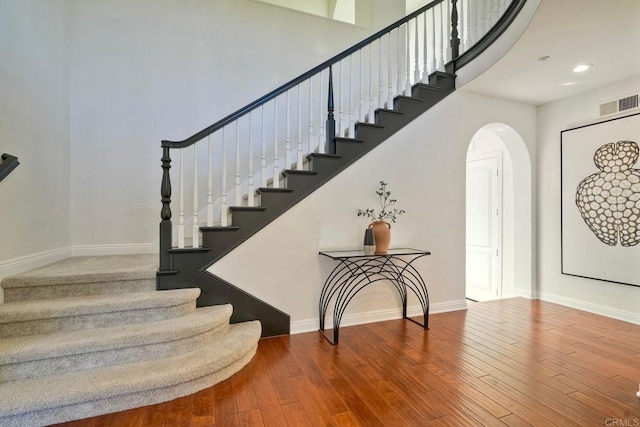 1664 Aryana Dr, Encinitas, CA 92024 - stairs with arched walkways, wood-type flooring, and recessed lighting
