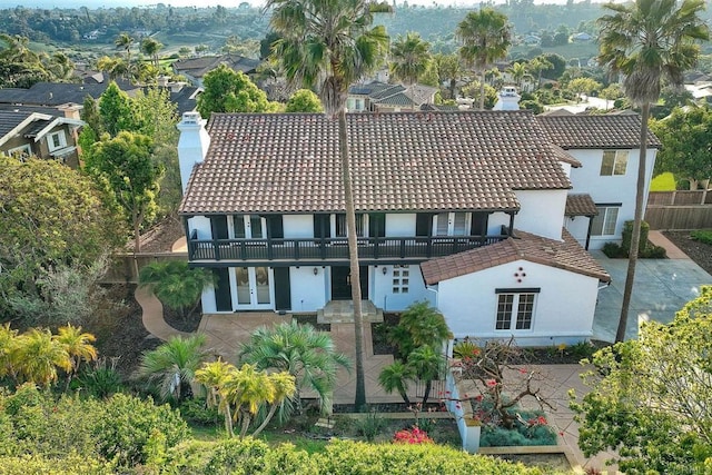 1664 Aryana Dr, Encinitas, CA 92024 - back of property featuring a chimney, stucco siding, a balcony, and a patio area