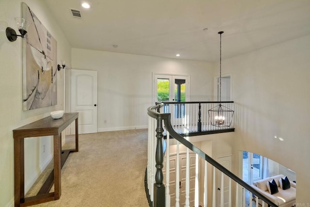 1664 Aryana Dr, Encinitas, CA 92024 - hall with an upstairs landing, carpet, recessed lighting, a chandelier, and french doors