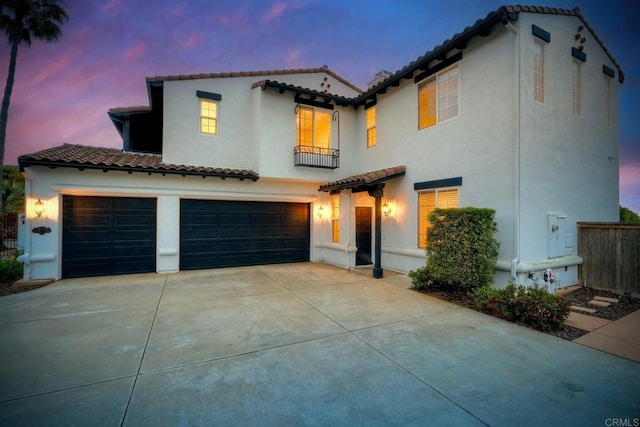1664 Aryana Dr, Encinitas, CA 92024 - mediterranean / spanish home with a tiled roof, stucco siding, and an attached garage
