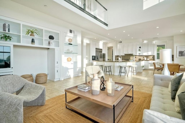 1664 Aryana Dr, Encinitas, CA 92024 - living area with light tile patterned floors, a high ceiling, and recessed lighting